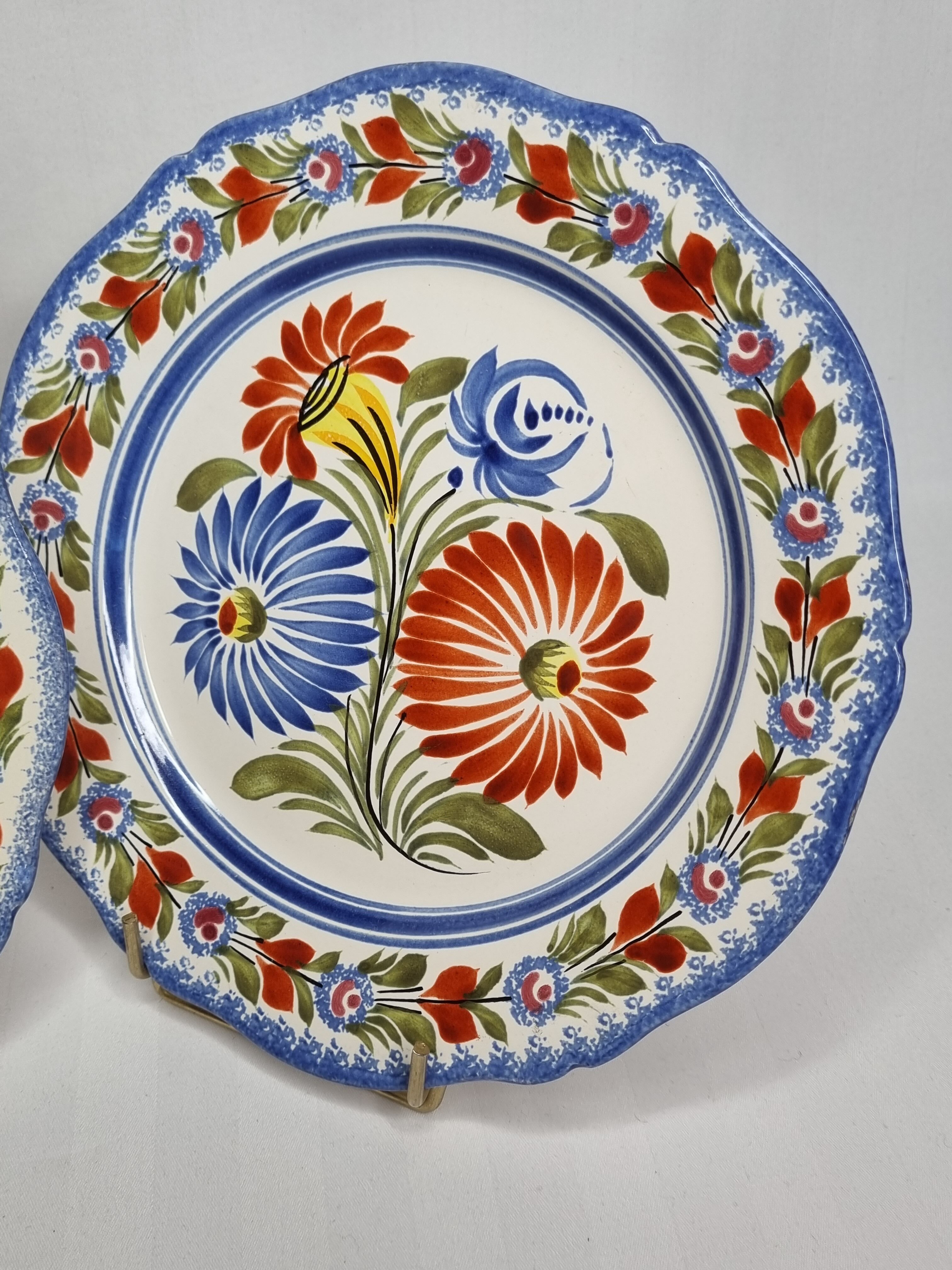 Pair of Henriot Quimper plates decorated with flower, 24 cm