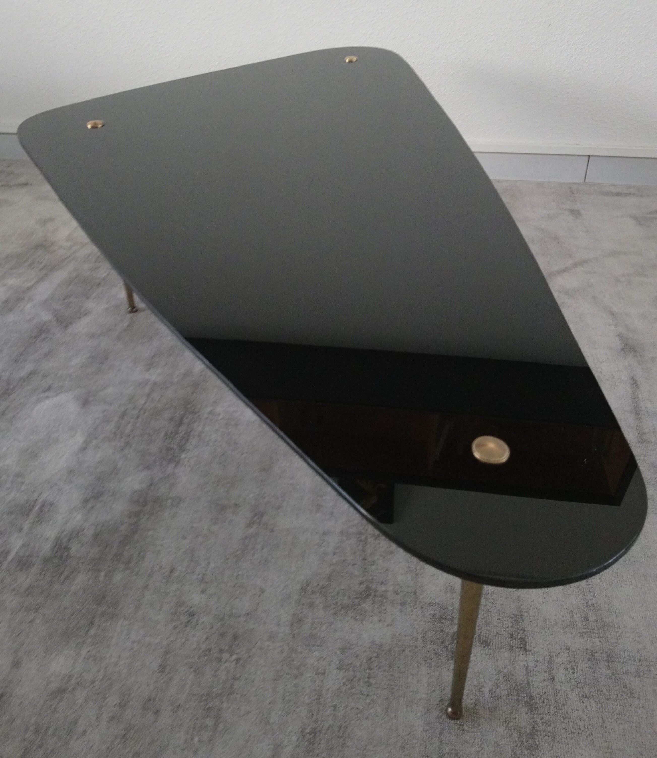 Tripod vintage black glass coffee table