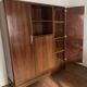 Rosewood desk, armchair and bookshelf.