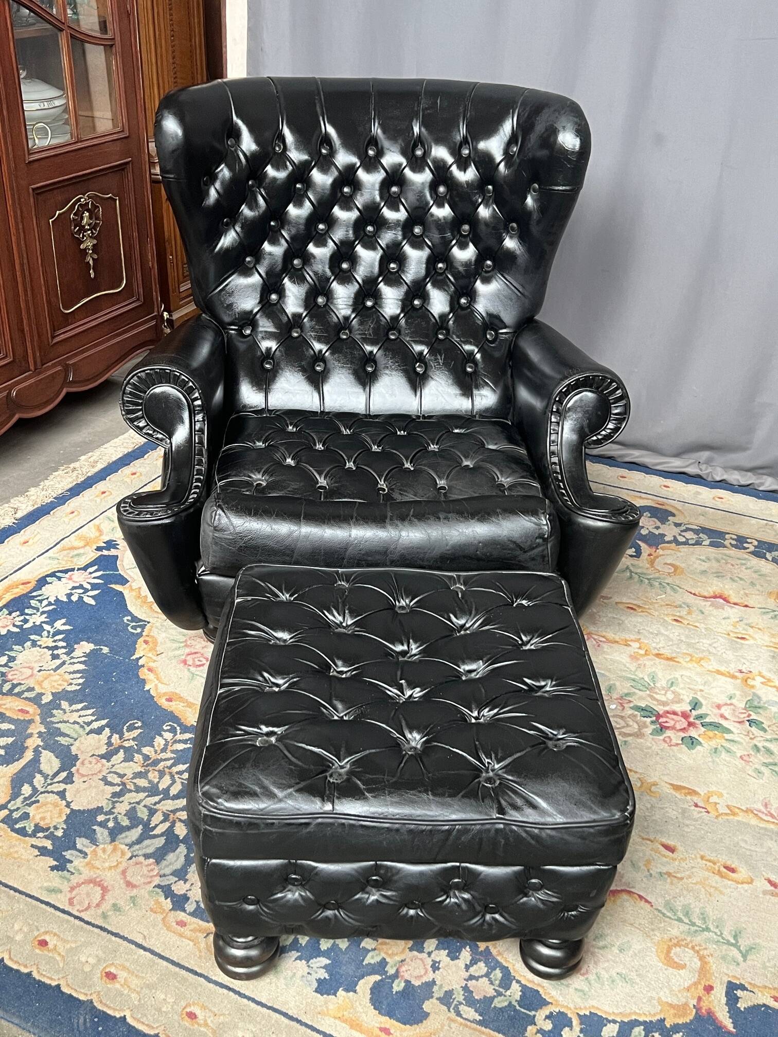 Chesterfield armchair and ottoman. Leather.