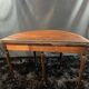 A Louis XVI period mahogany half-moon table forming a console/games table