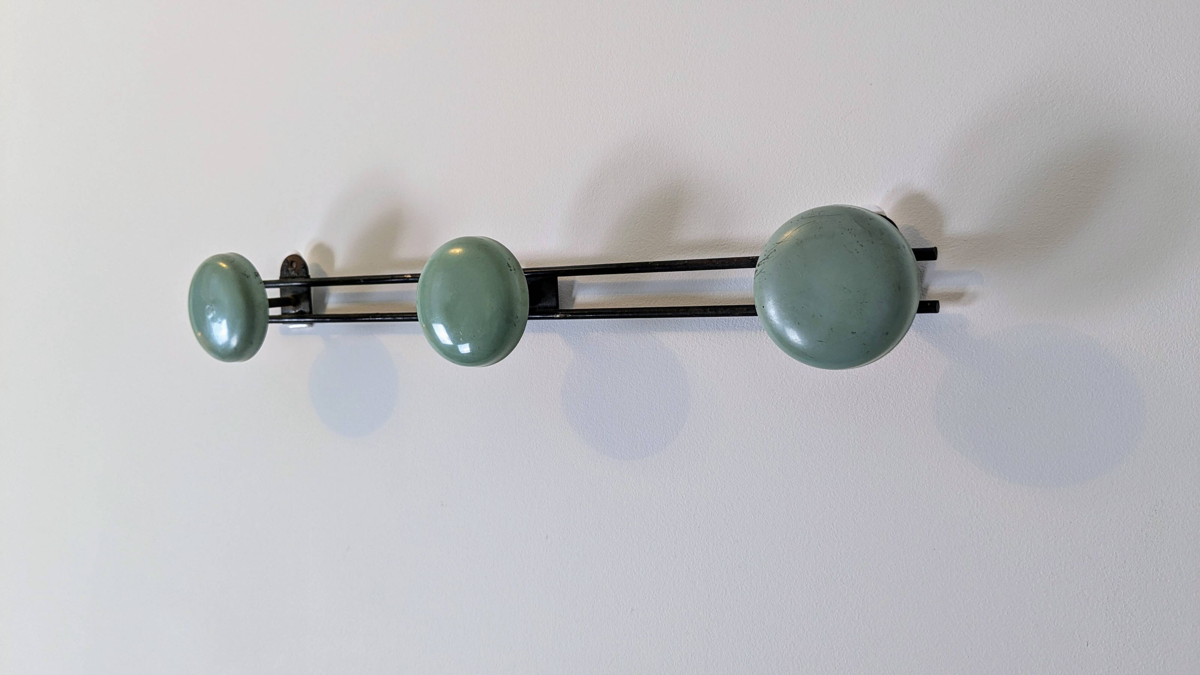 Vintage green metal triple coat hook