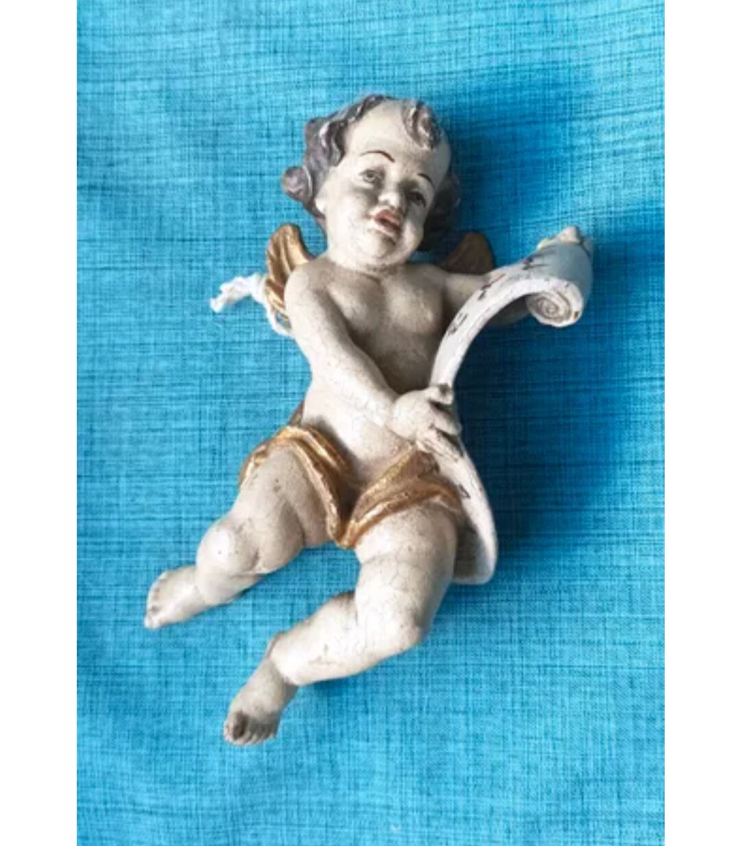 Golden white wooden cherub