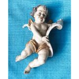 Golden white wooden cherub
