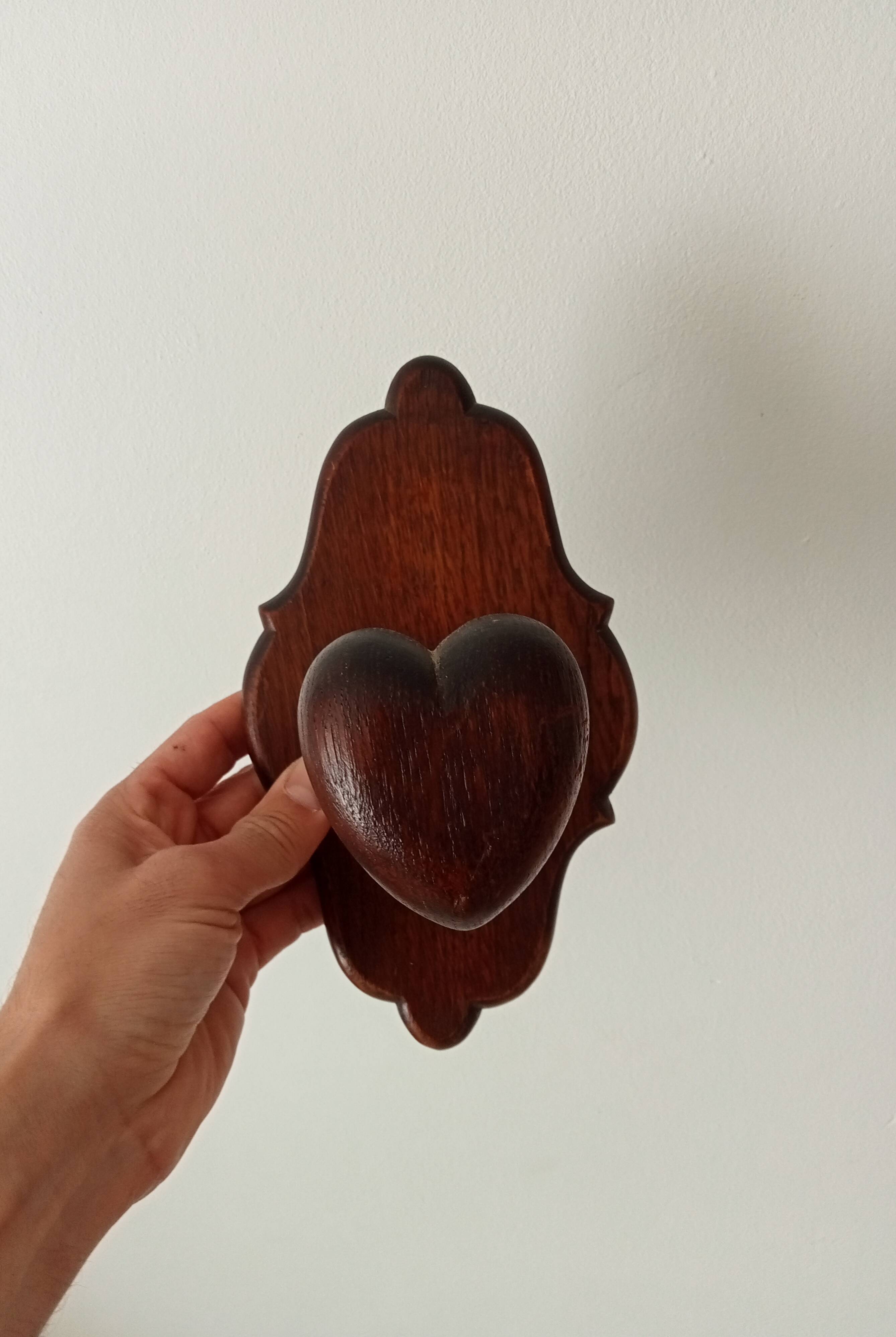 Vintage wall coat rack in carved solid wood, popular art.