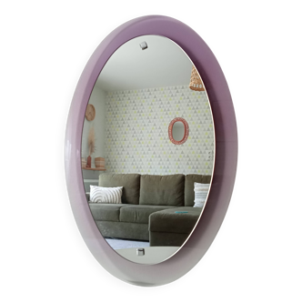 Vintage oval plexiglass mirror from the 70s by Harvey Guzzini
