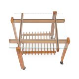 Wood and glass coffee table with wheels, 1960s.