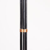 Black floor lamp on tripod base
