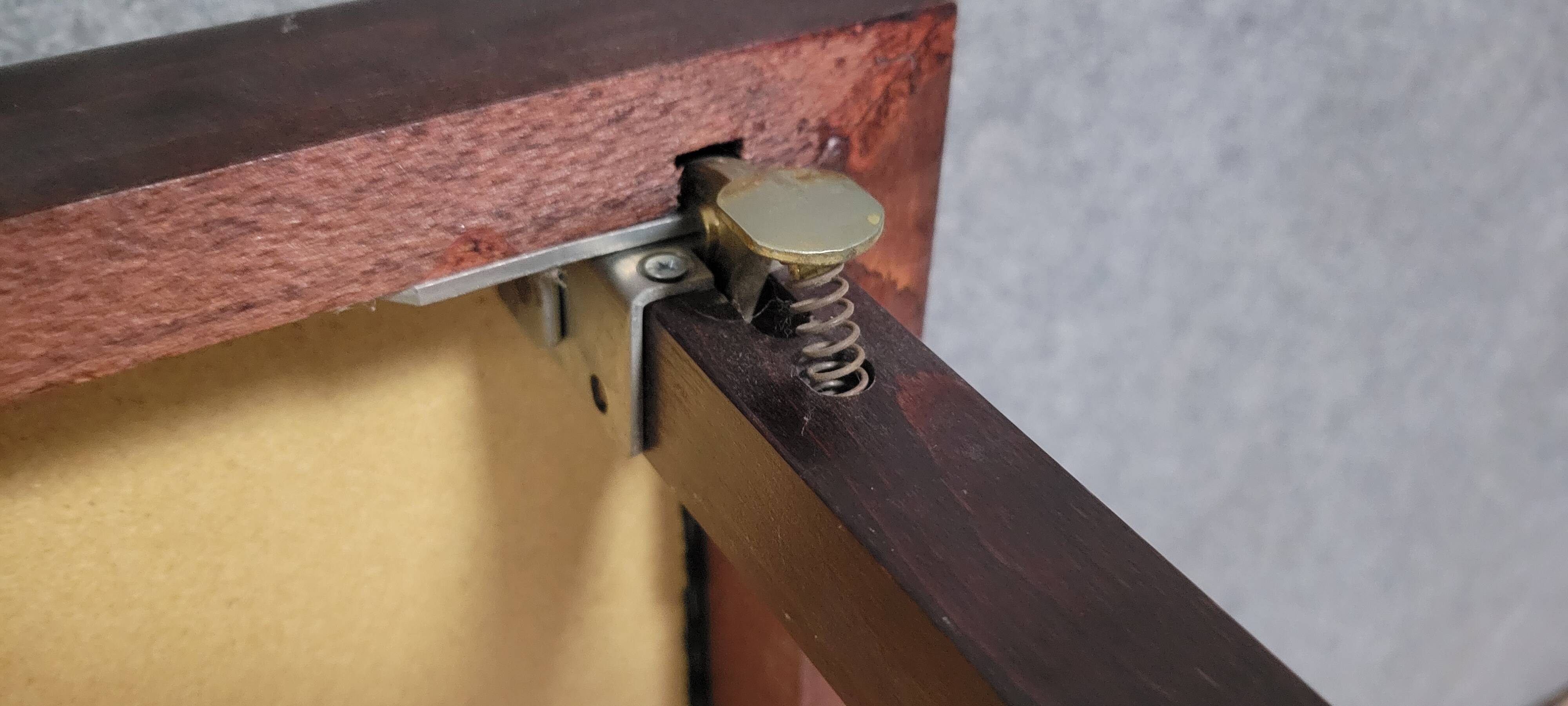 a wooden Bridge game table resting on four thin, straight legs