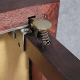 a wooden Bridge game table resting on four thin, straight legs