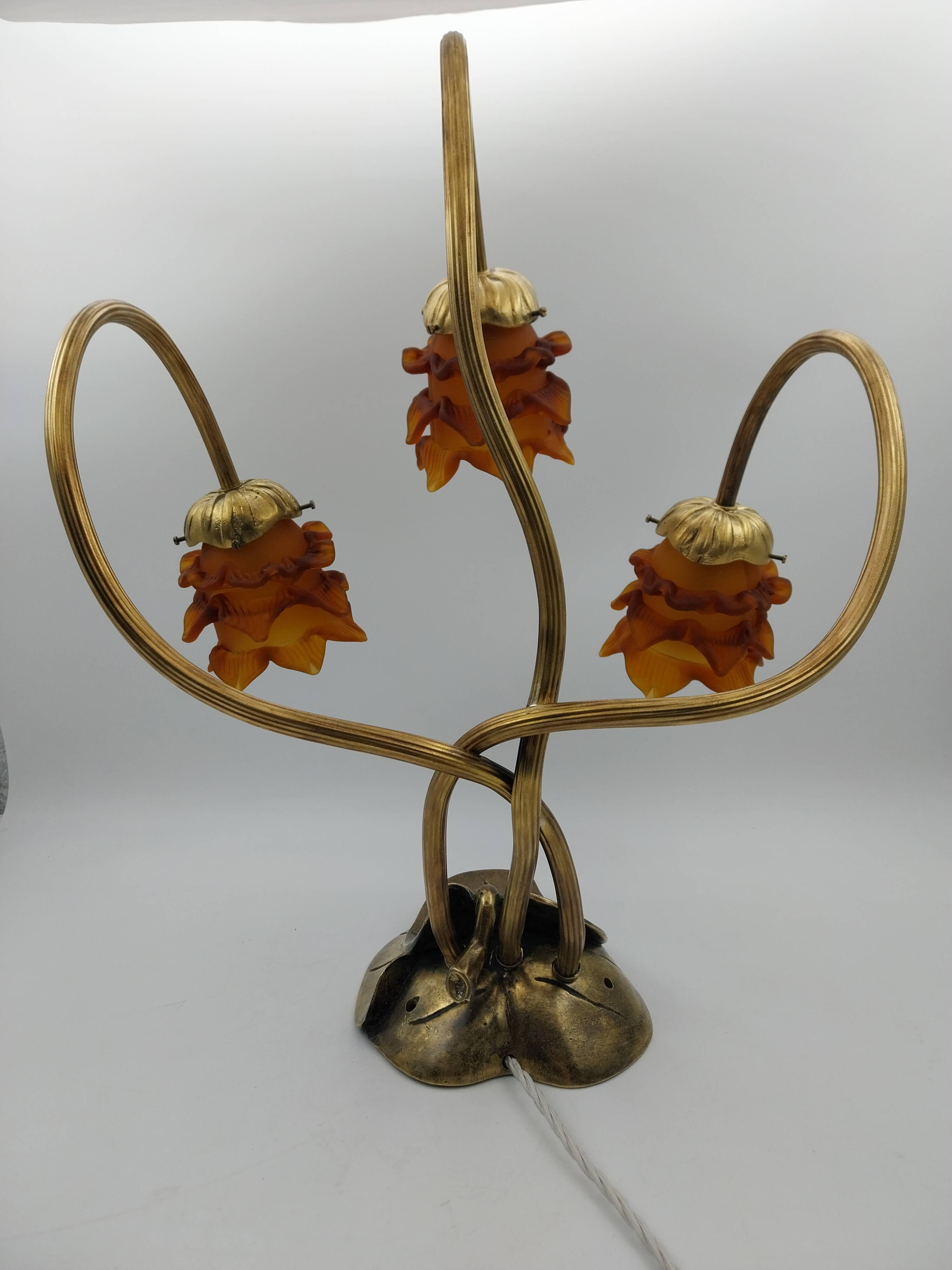 Lamp with brass leaves and glass paste flowers.