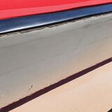 Vintage sofa 3 places convertible, red fabric and black skaï.1960s.