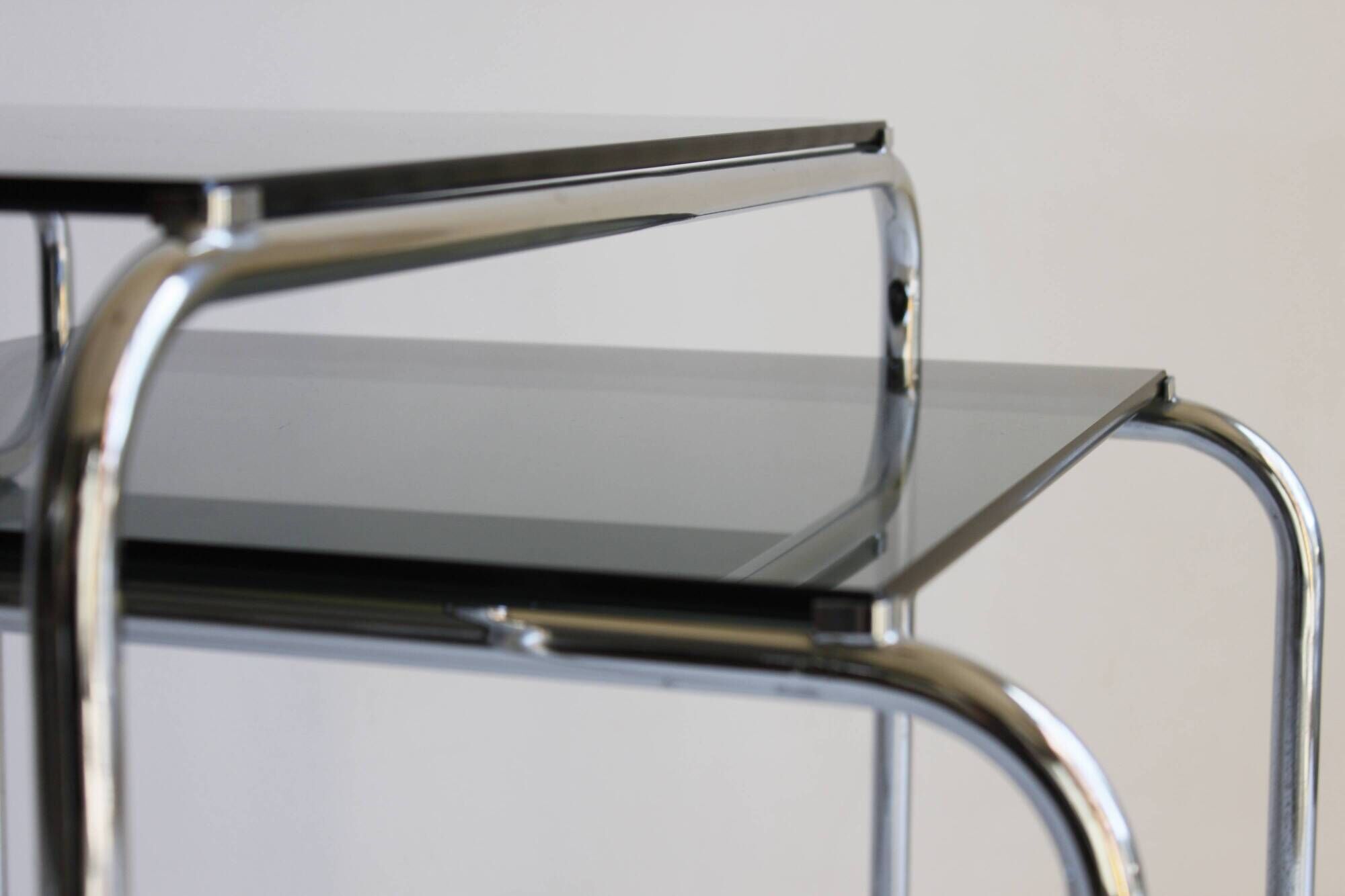 Tubular steel and smoked glass side tables, set of 2