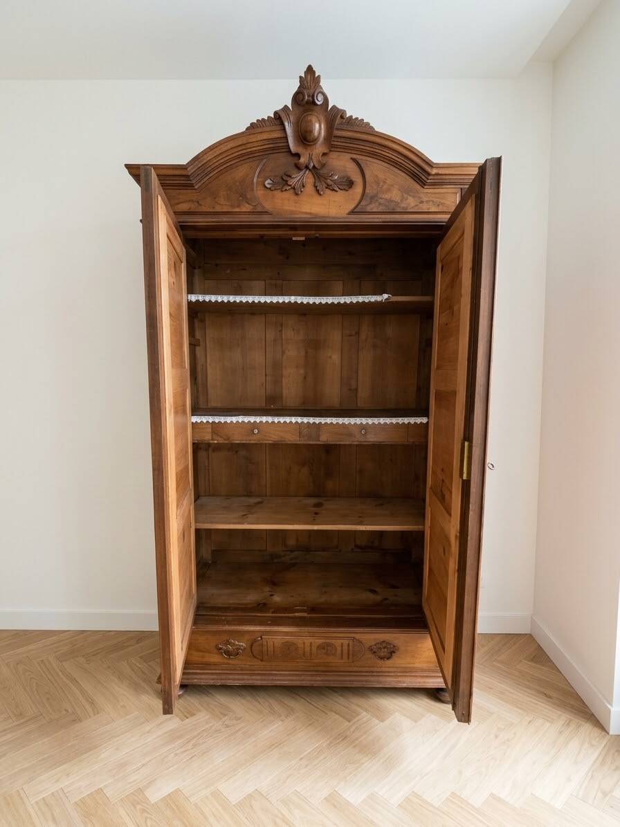 Antique walnut wardrobe with bevelled mirrors.