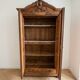 Antique walnut wardrobe with bevelled mirrors.