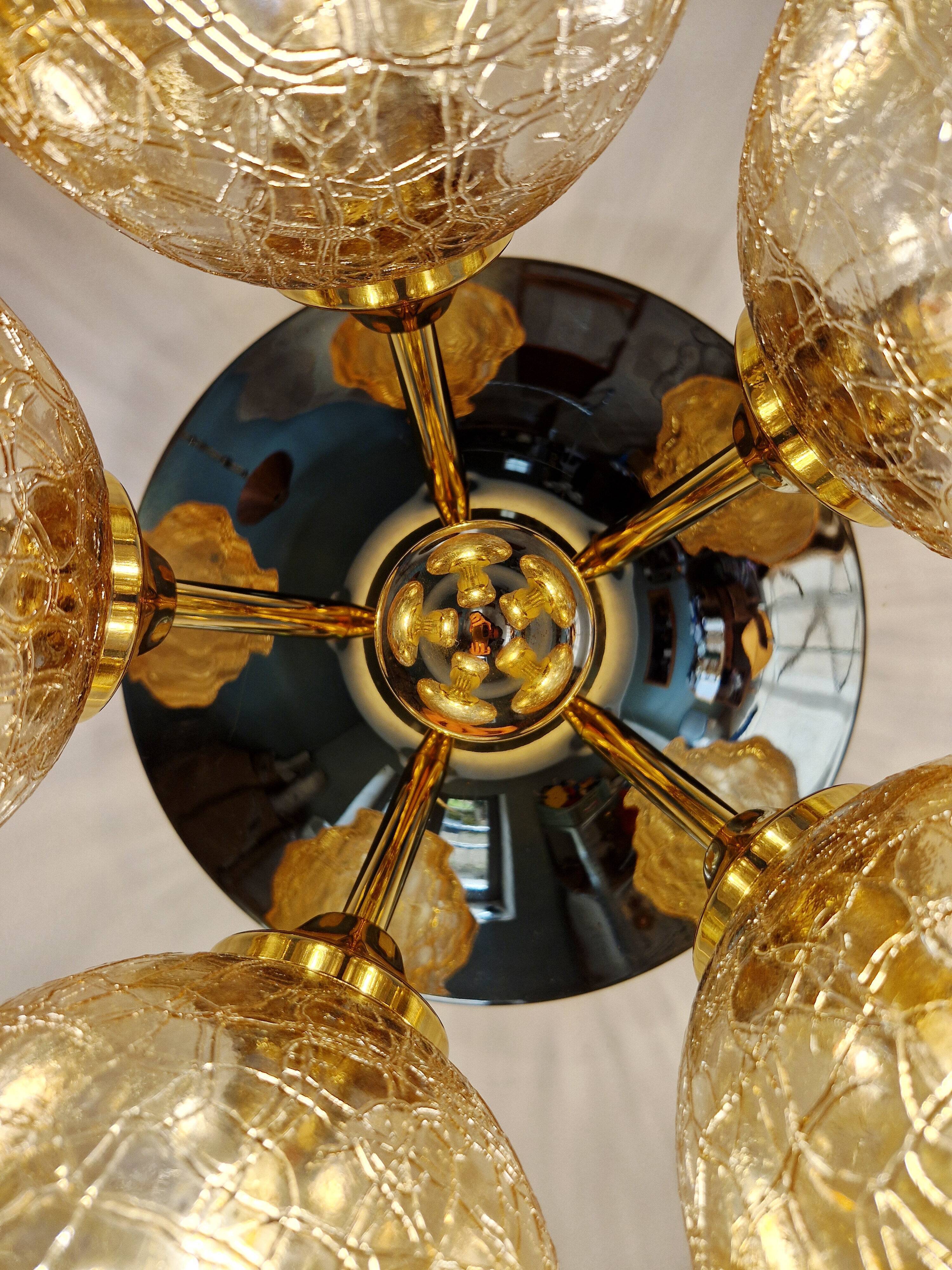 Large designer ceiling light in brass and amber crackled glass, 1970s.