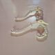 set of 2 vintage white cast iron hooks, small paint chips from the year