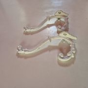 set of 2 vintage white cast iron hooks, small paint chips from the year