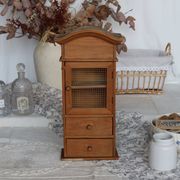 Vintage wooden shelf with drawers and mesh door.