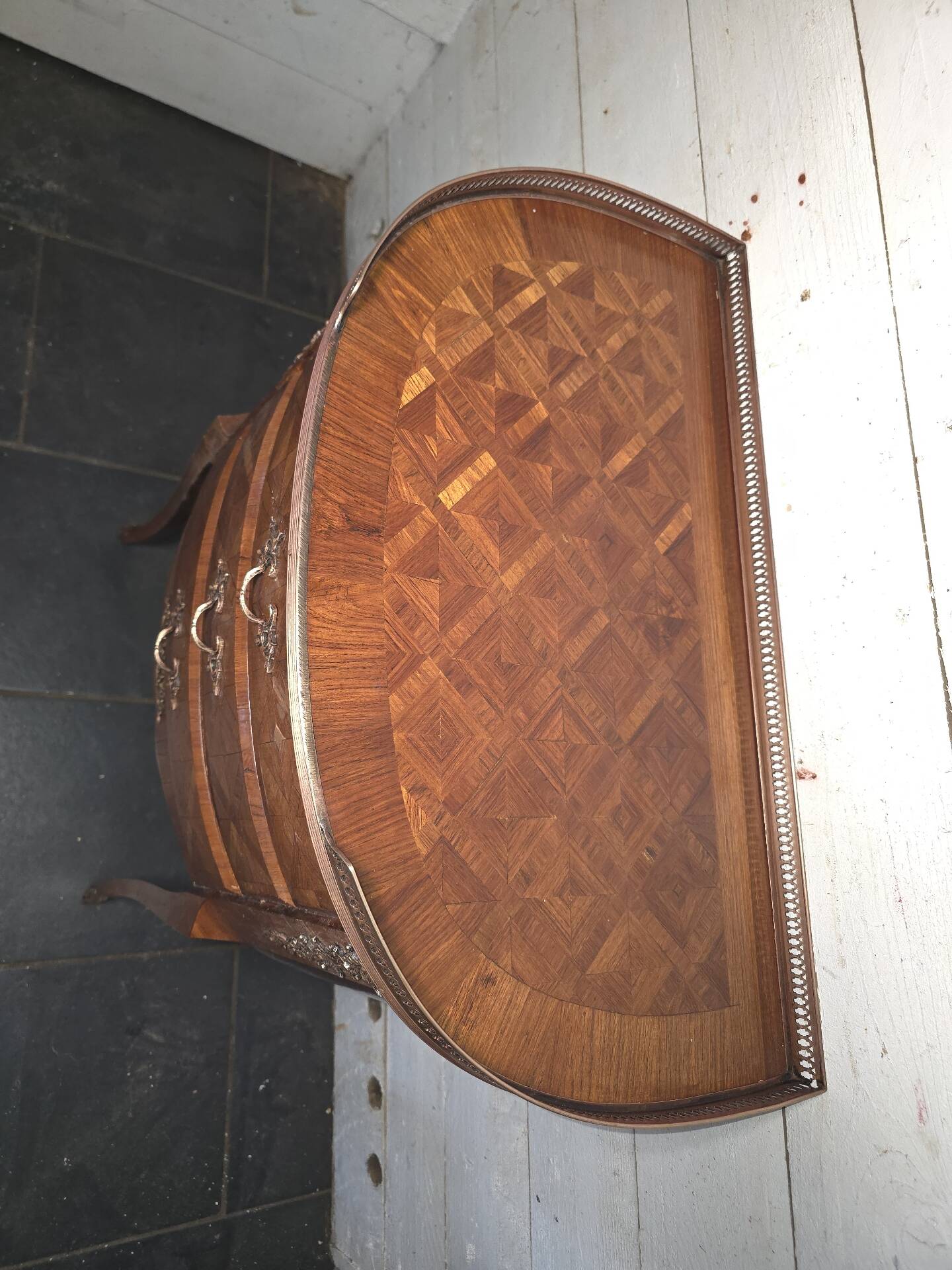 Small curved chest of drawers in Louis XV style with marquetry.