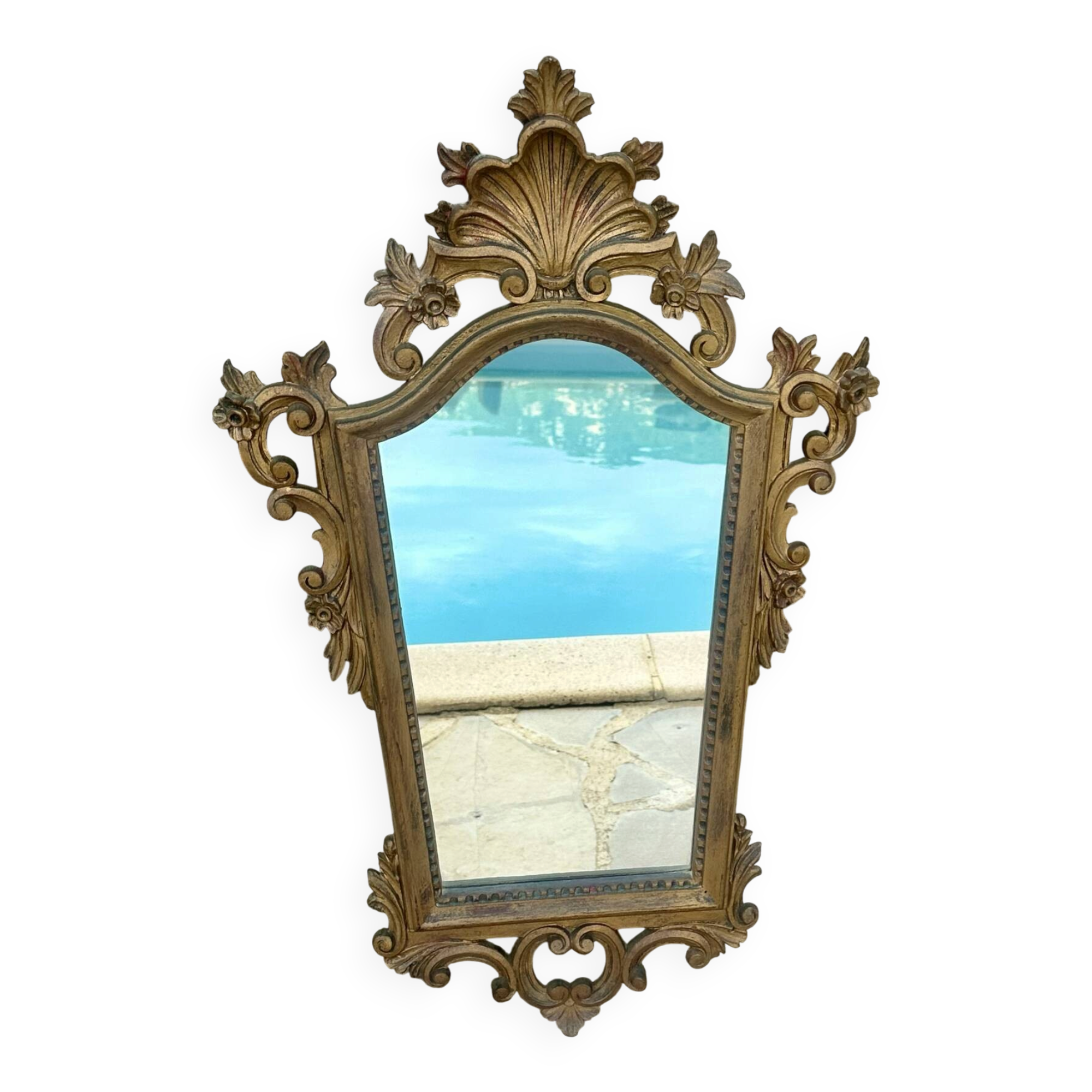 Carved and gilded wooden wall mirror.
