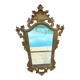 Carved and gilded wooden wall mirror.