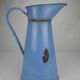 Old vintage enamelled sheet metal jug