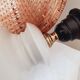Ceramic lamp with rattan lampshade.