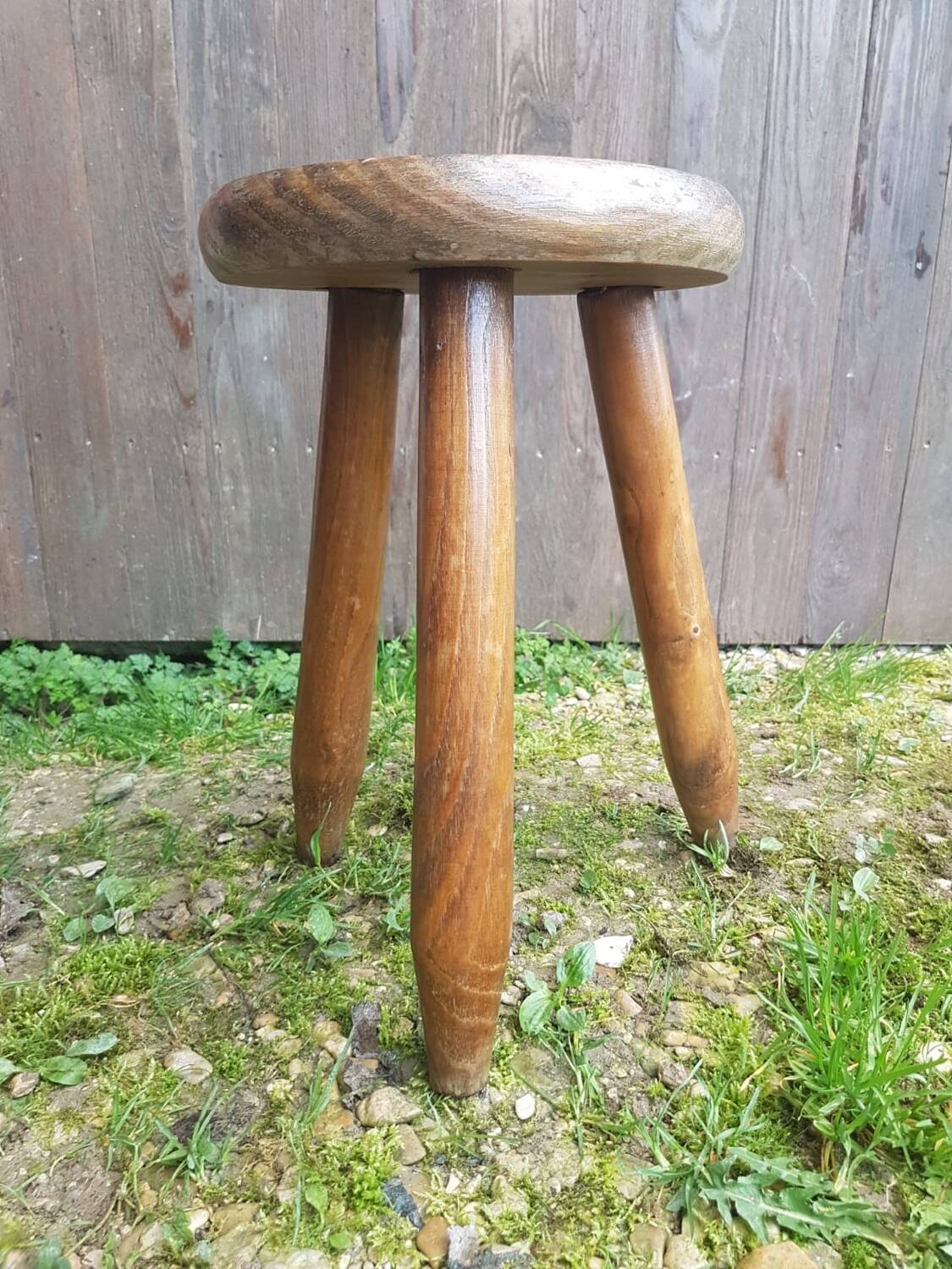 Old vintage wooden tripod milking stool