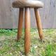 Old vintage wooden tripod milking stool