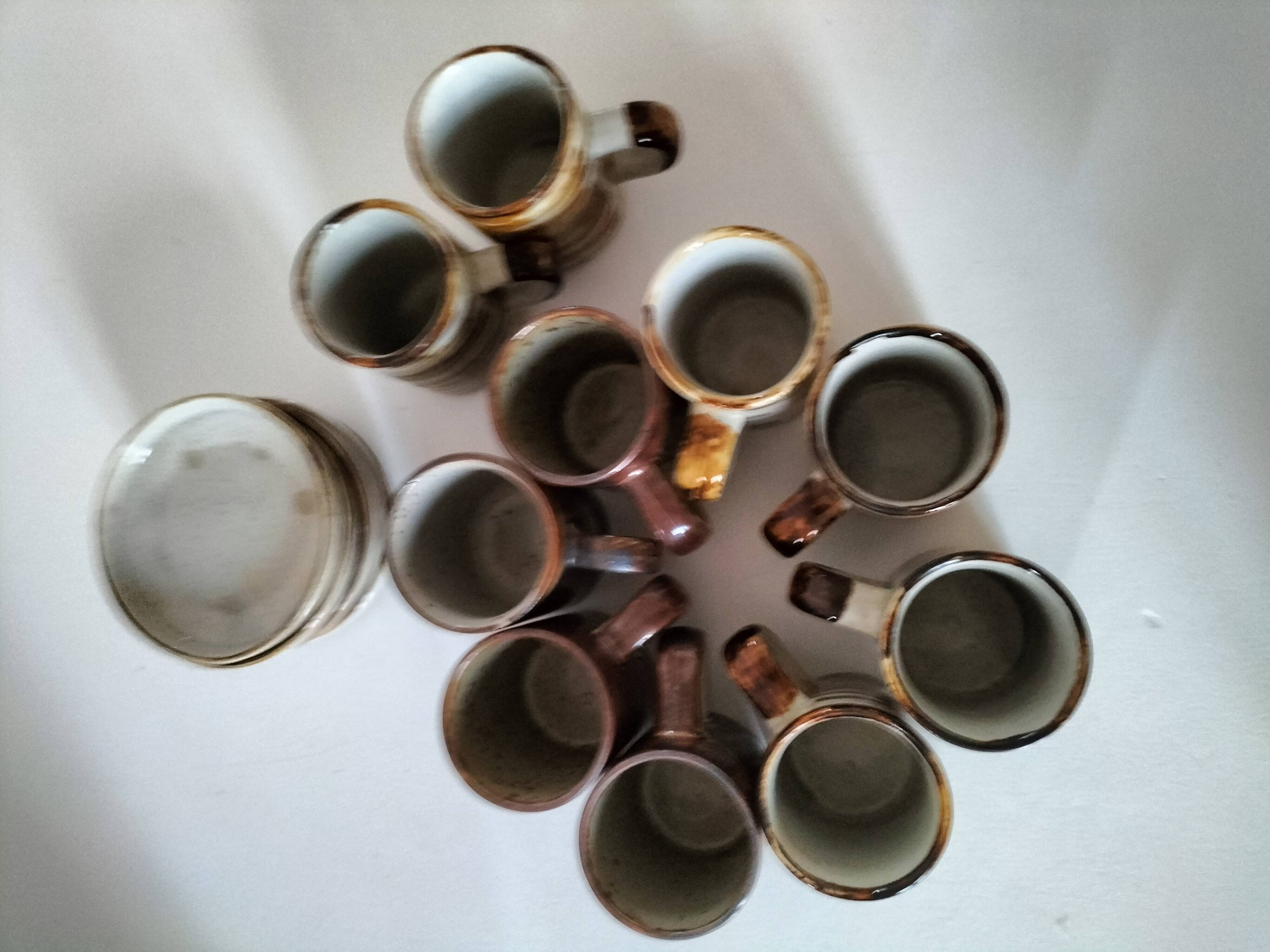Set of rustic stoneware with 10 cups and 5 saucers from the 1970s.