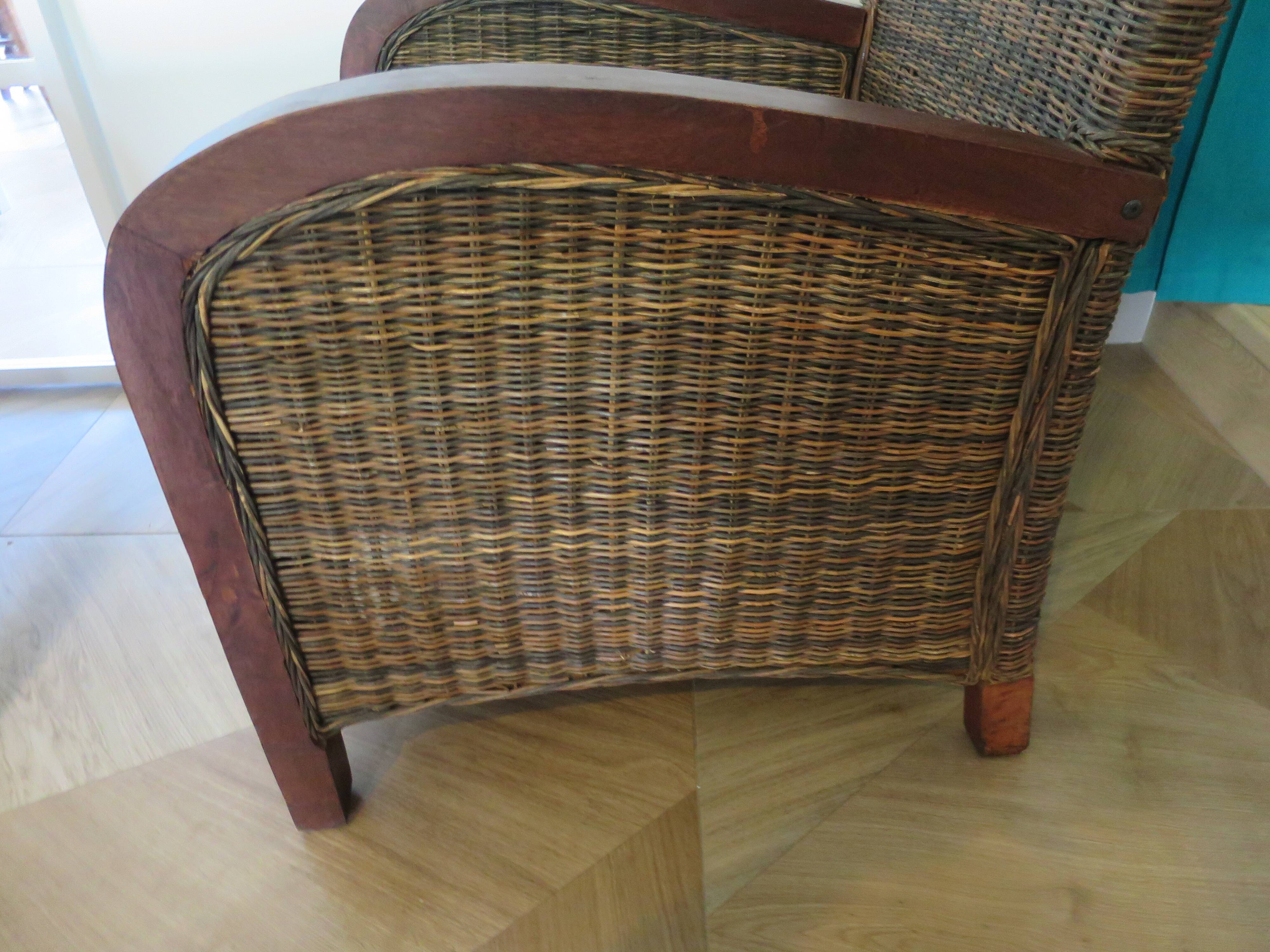 2 colonial-style armchairs in woven rattan and exotic wood