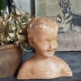 Bust of a small child in ancient plaster