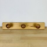 Wall coat rack with pine ball hook