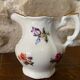 Petit pot à lait ou crémier décor fleurs et liséré doré