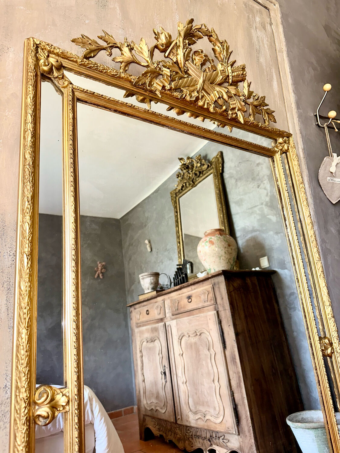 Antique gilded mirror with parcloses from the 19th century.