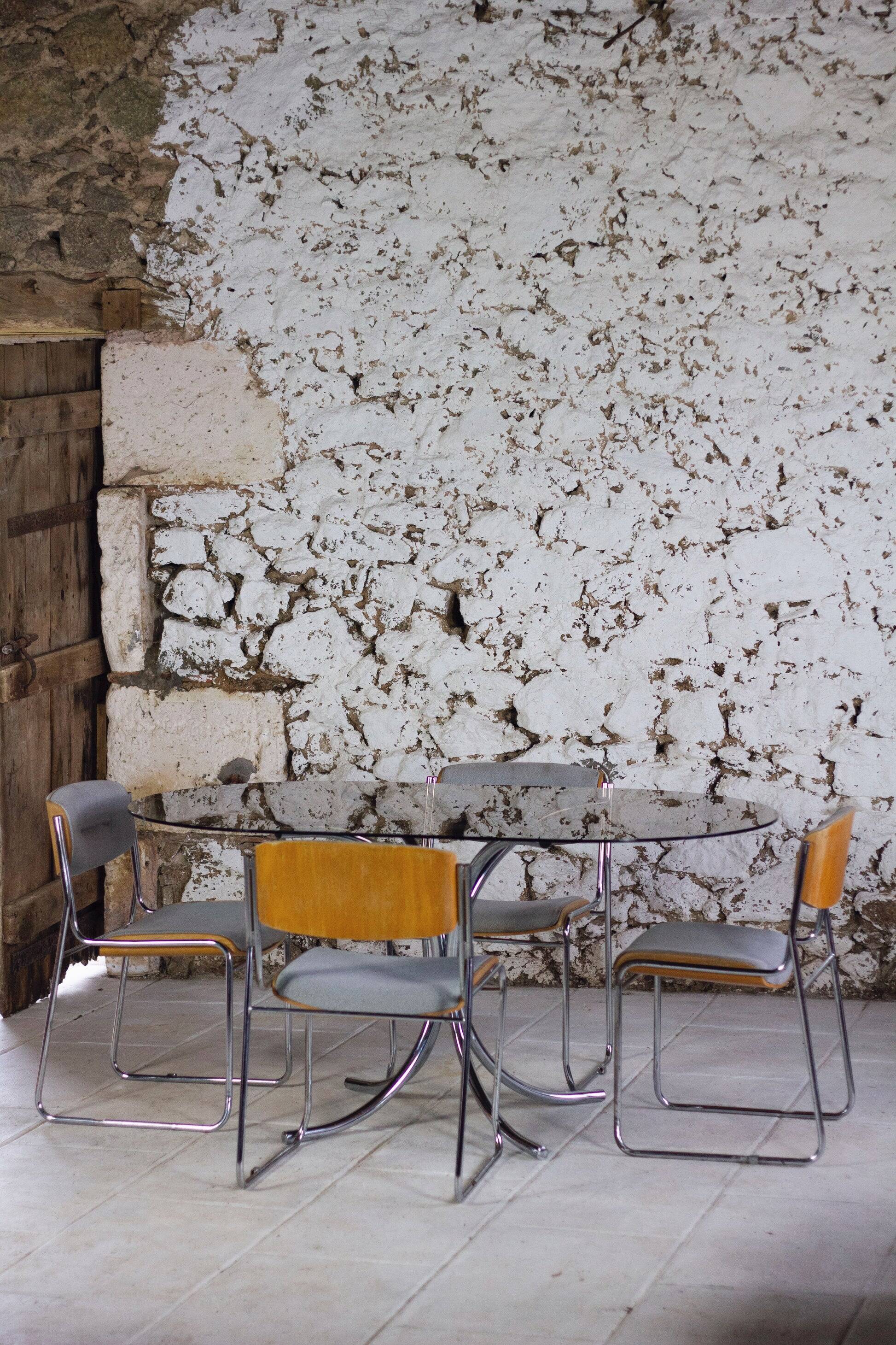 Oval dining table in chrome and smoked glass, 1970.