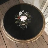A gilded carved wooden pedestal table with a marble marquetry top