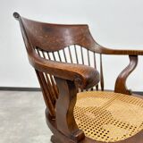 Swivel office chair in oak with a rattan seat.