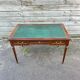 Louis XVI style desk in mahogany with a green leather top.