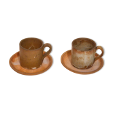 Pairs of cups and saucers in sandstone
