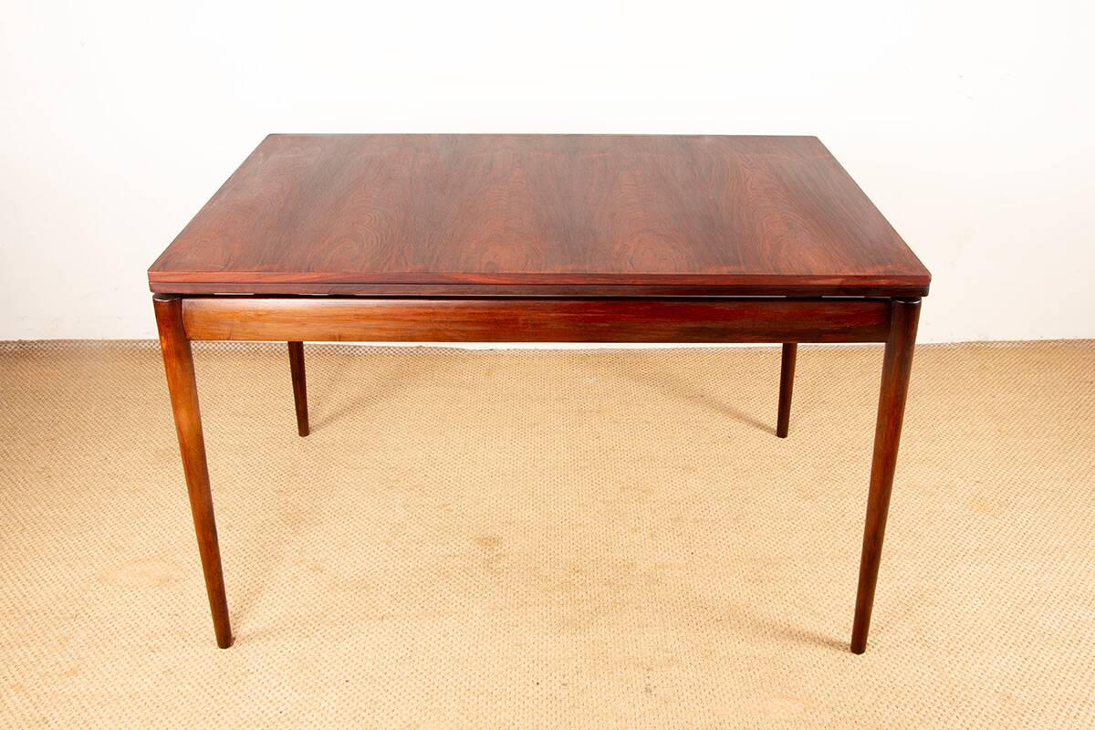 Danish extendable dining table in rosewood and brass by Poul Volther