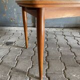 Extendable teak dining table