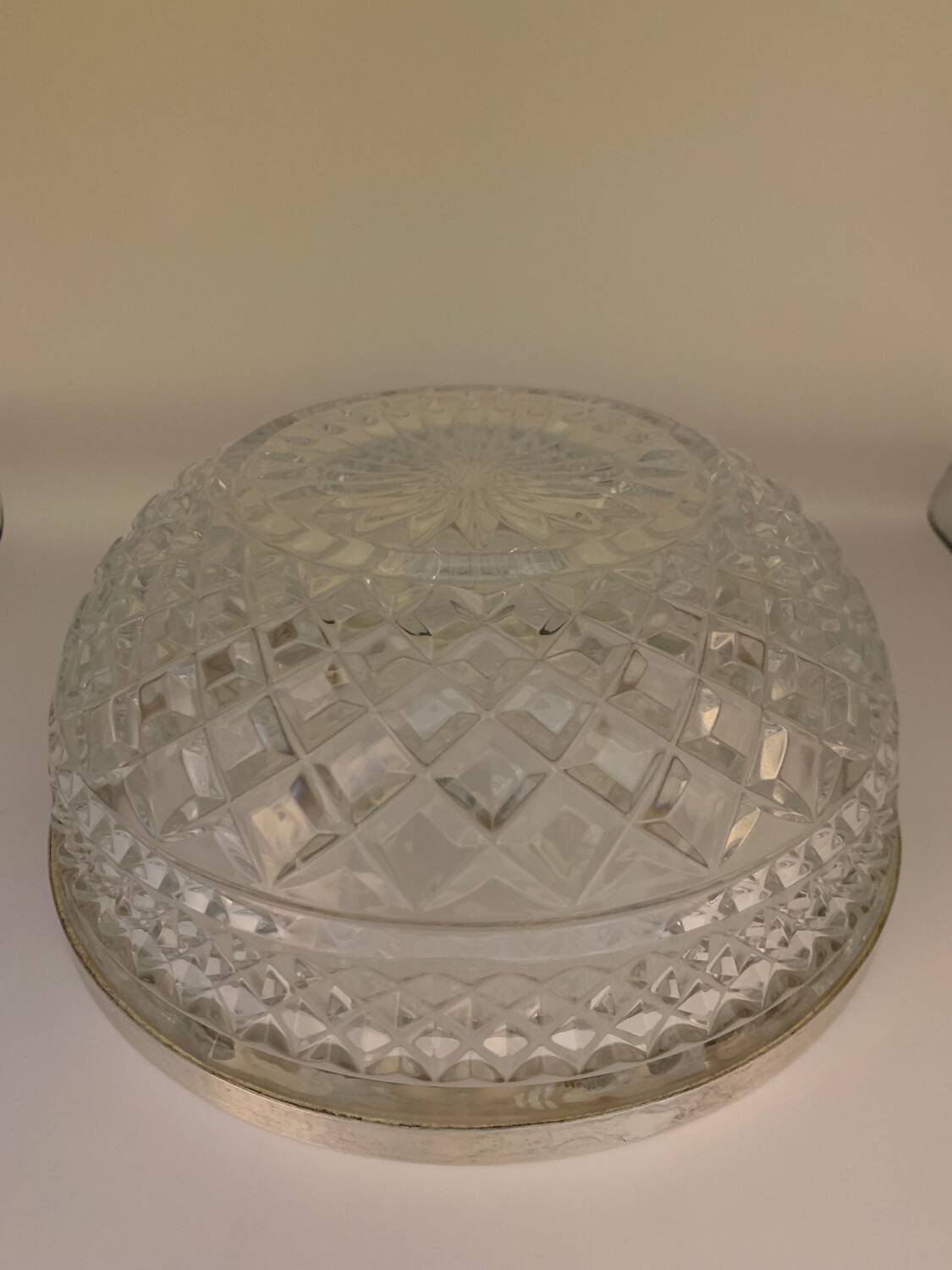 Chiseled glass (crystal?) salad bowl with silver metal edge