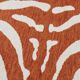 Vintage orange and white zebra rug in ethnic style.