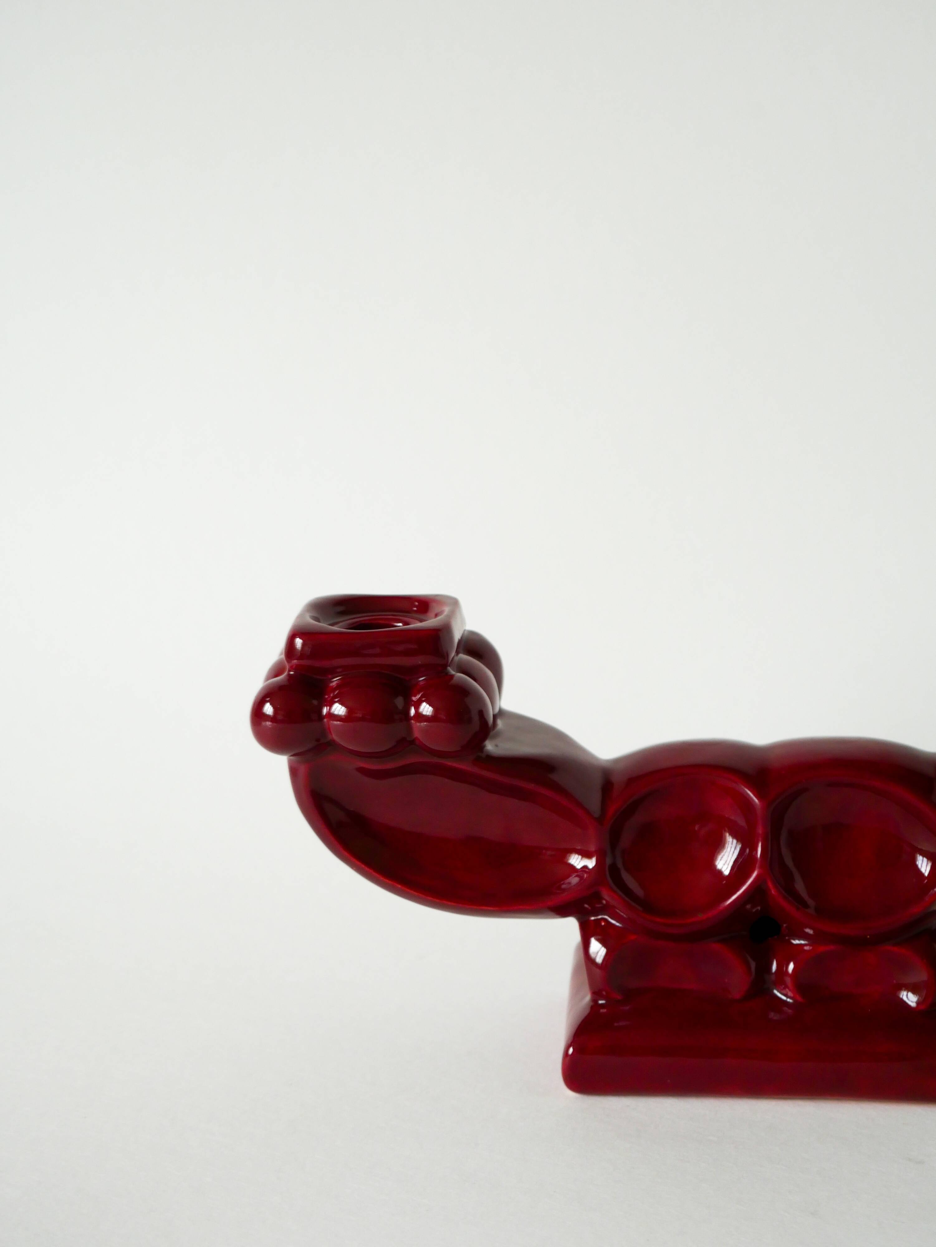 Pair of large burgundy ceramic candlesticks, 1950