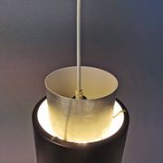 A set of beautiful cylinder shaped hanging lamps in silver color with black "ring" Danish 1970s.