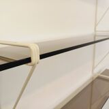 Large vintage wall shelf in smoked glass and white metal in String style.