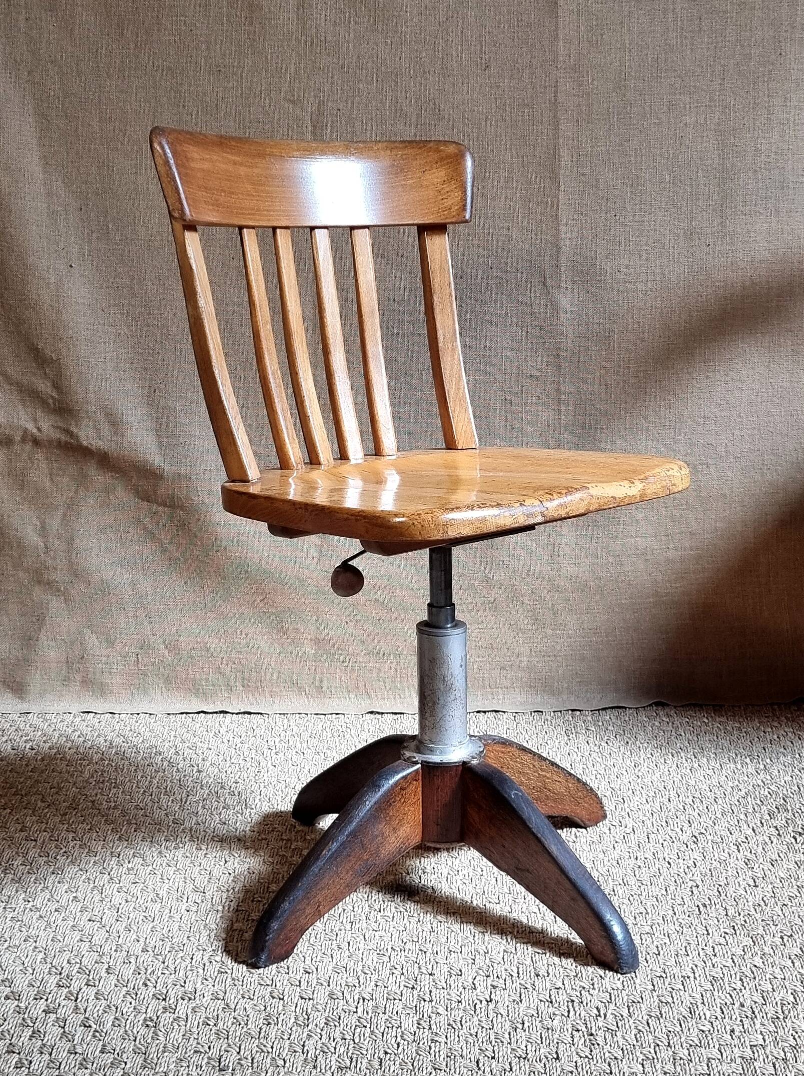 Height-adjustable rotating workshop office chair