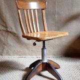 Height-adjustable rotating workshop office chair